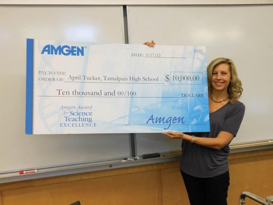 AWARD WINNER: Ms. Tucker was surprised with a giant check from the Amgen foundation. Photo by: Emma Boczek
