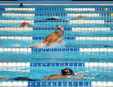 BREAKING THE SURFACE:  Brigitte Winkler comes up for air during a breaststroke race at the Olympic Trials. Photo courtesy of: Peter Macintosh