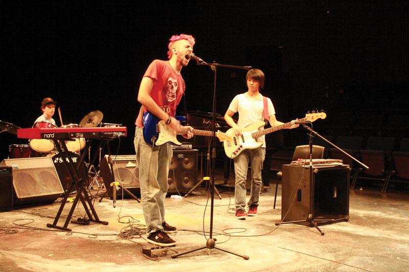MAXIMUM VOLUME: Seniors Ryan Adams, Mitchel Wong and Matthew Tarantino (vocals/guitar, bass, and drums, respectively) perform “Aneurysm” by Nirvana at the band class concert.    