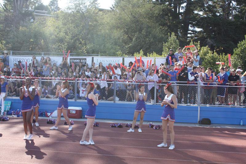 A REAL CROWD:  Tam students, sporting Hawks colors and rally tubes, packed into the stands to watch the 2012 Homecoming game. This could be a regular occurrence that would help our teams. Photo by: Chris Yip