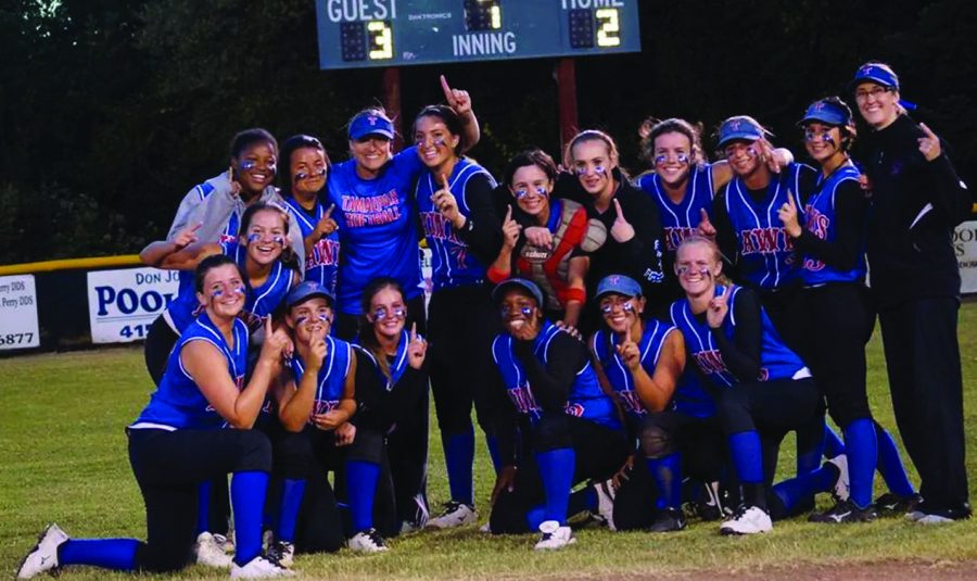 BRINGING HOME THE GOLD: The softball team poses above after winning the NCS championship on May 31 at San Marin High School.This is the first NCS Softball title Tam has every won.                                                                                      