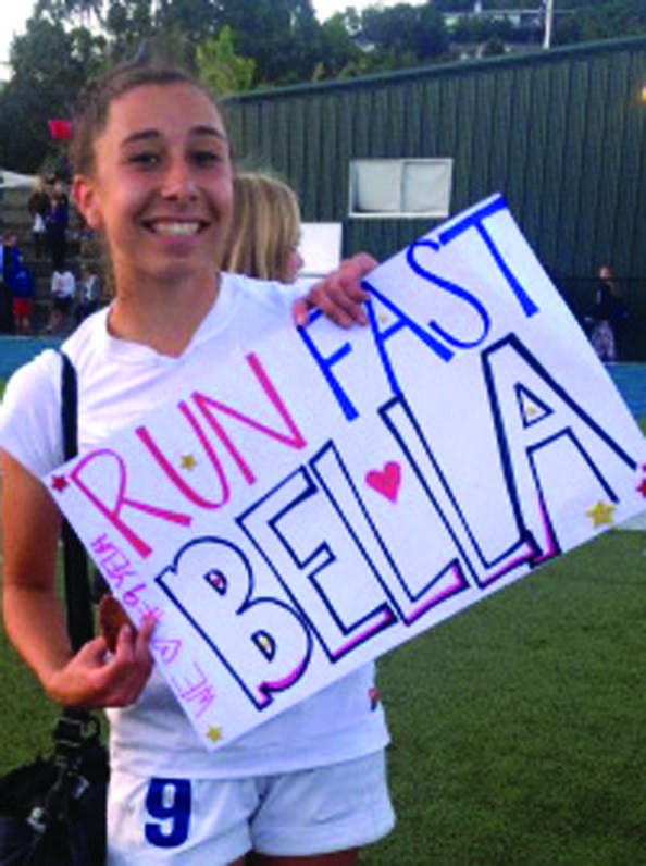 WE GOT SPIRIT: Bella Amyx holds a fans sign after winning the MCAL championship.   