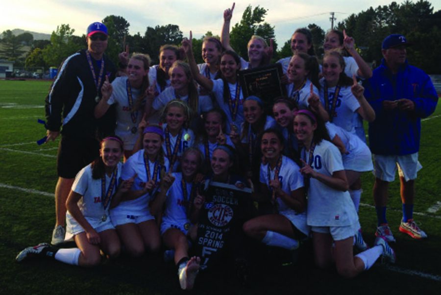 TWICE IS NICE: The Tam girls’ varsity soccer team celebrates after defeating Marin Catholic. This was the second time Tam had beaten MC in penalty kicks. The game took place at Terra Linda on May 23rd.             