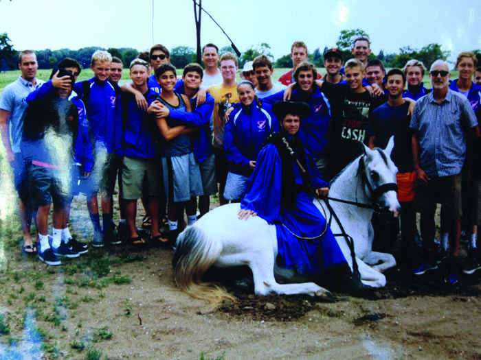  The Boys’ Varsity Waterpolo team and Christina Amoroso pose for a photo while in traveling in Hungary over the summer and competing in a waterpolo tournament.                                                                                    Courtesy of: Bob Kustel