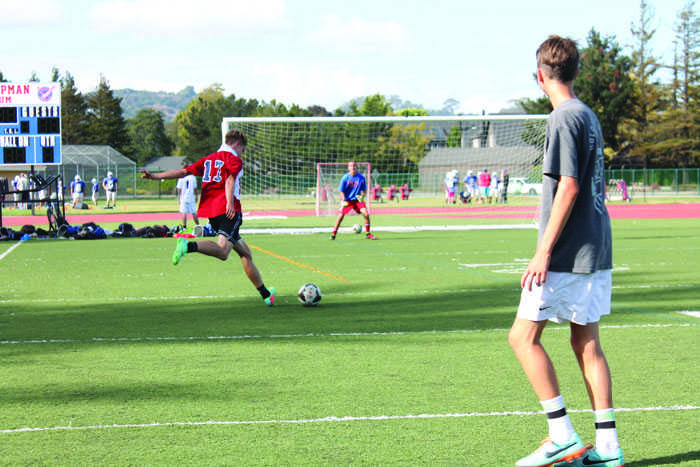 WIND UP FOR A SHOT: Senior Jake Isola-Henry gets ready to shoot the ball at the goal in an afternoon practice on the Tam Turf.                                 	             Photo by: Nate Vogel