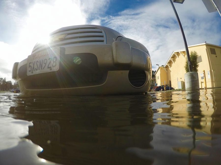 Heavy rainfall combined with king tides on January 12 lead to widespread flooding—including in the pool parking lot.