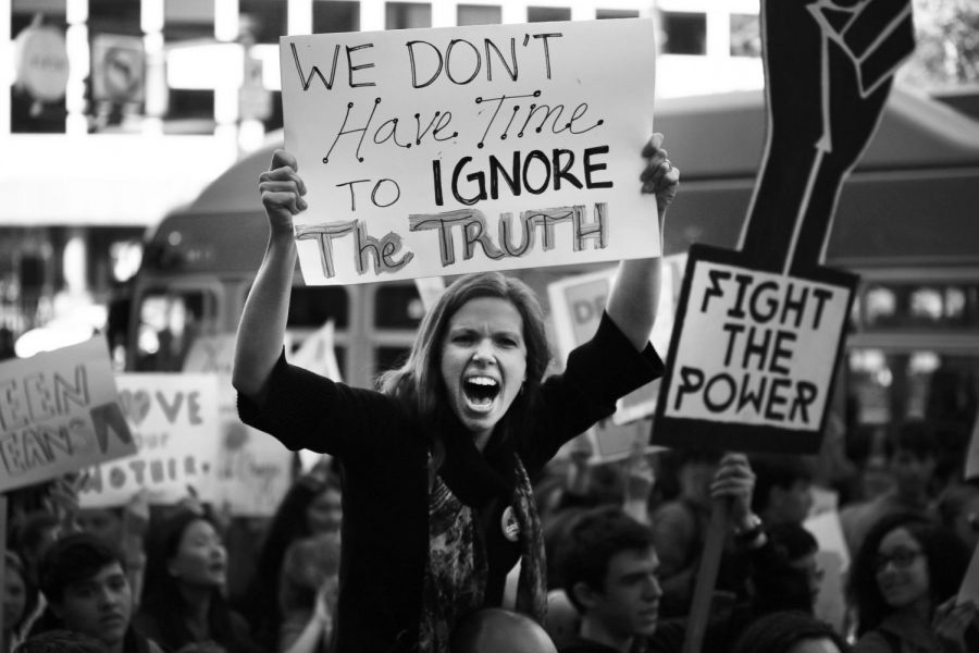 A woman yells during the Youth Climate Strike protesting climate change in San Francisco, Friday, March 15, 2019. Thousands of students around the world protested the perceived inaction from their lawmakers in regards to climate change.