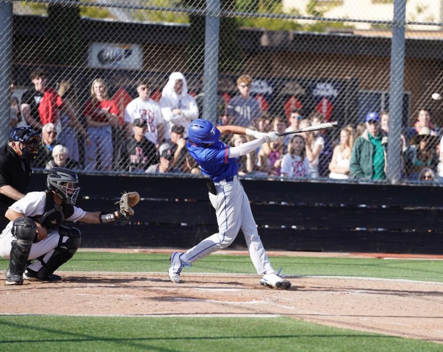 Kaiden Dossa taking a swing at a pitch