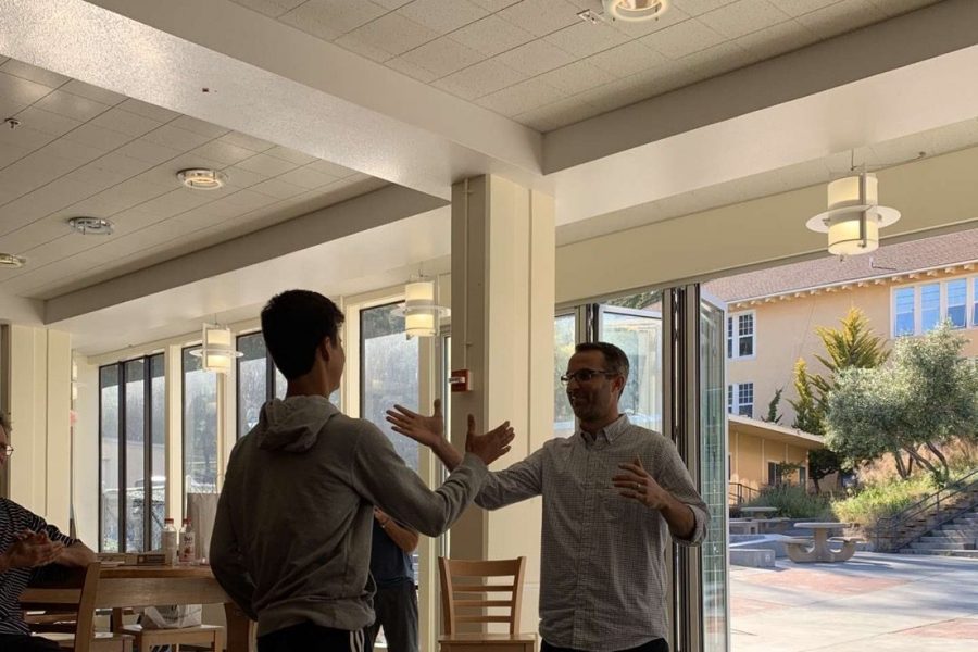 Coach Morgan delivers a high five to senior Tyler Reed, before he stepped down as the Tam basketball coach in 2020. (Courtesy of Tyler Reed) 