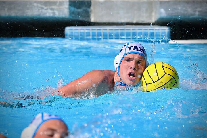Senior Andrew Wallace swims down the pool.