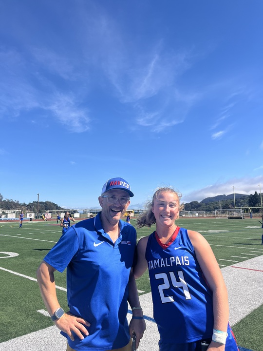 Senior Quinlin Dayton (left) with coach Ed Cortis (right).