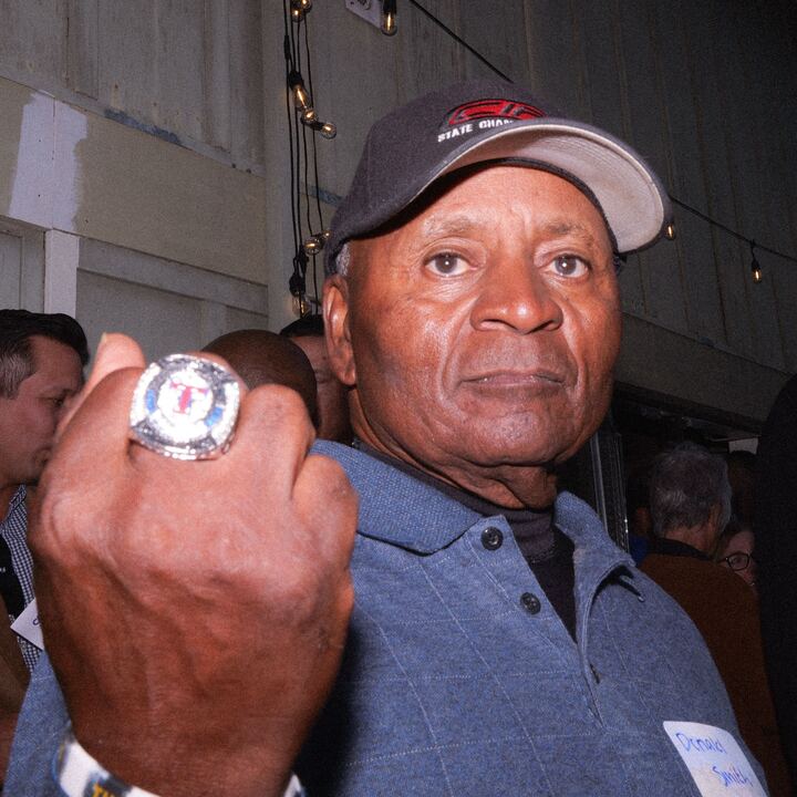 Donald Smith holds up his 2000 championship basketball ring.