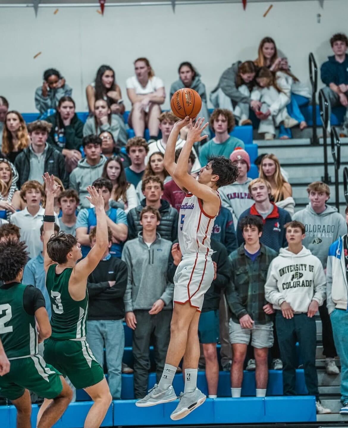 Porthos Olivera shoots a fadeaway.