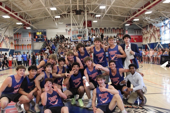 Tam seniors pose for a photo with their trophy.